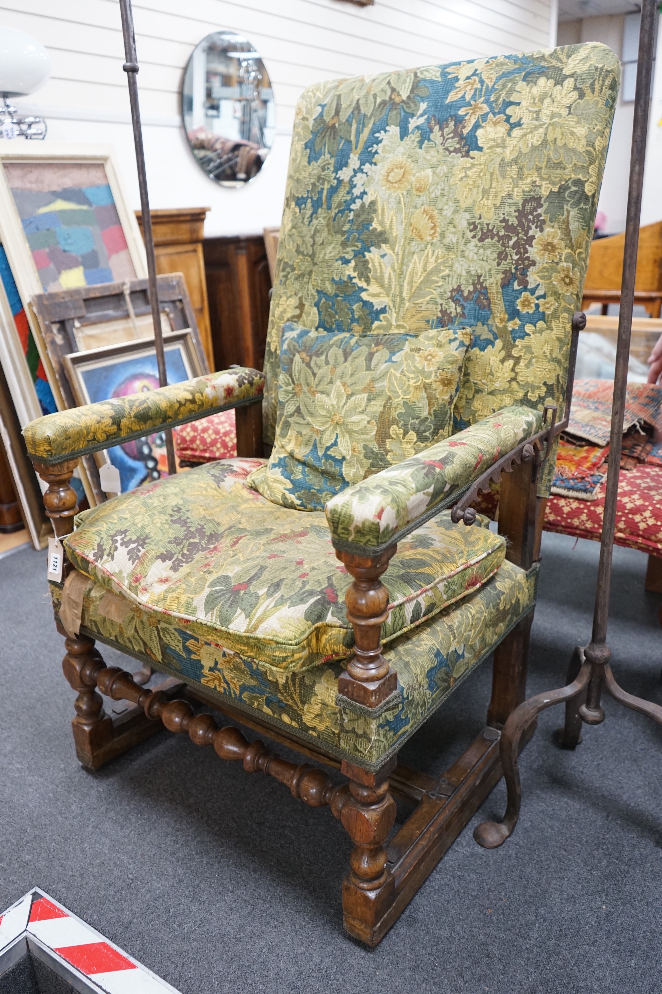 A 19th century French carved walnut reclining armchair, width 74cm, depth 59cm, height 120cm